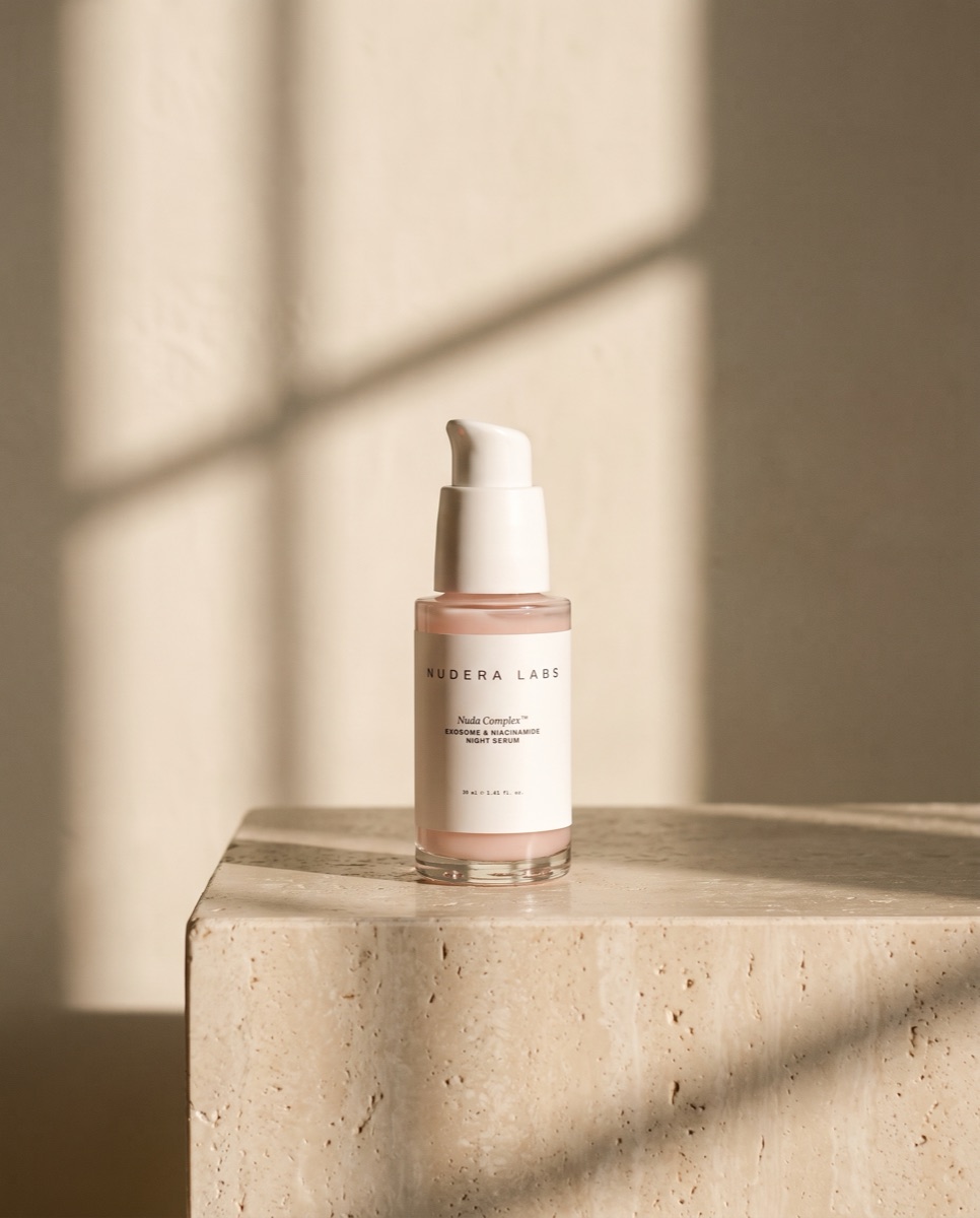 NUDA COMPLEX night serum on travertine